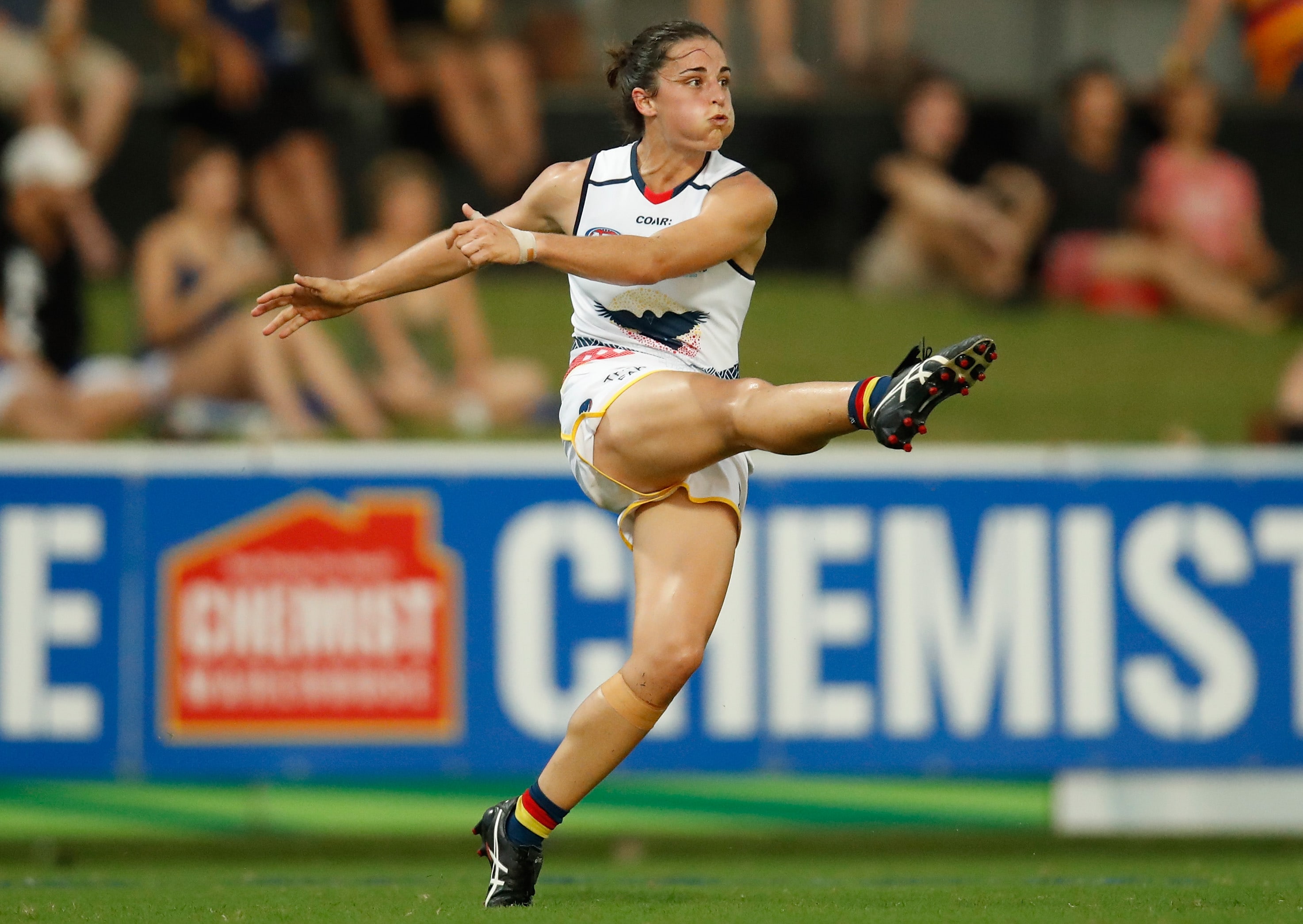 AFLW 2017 Rd 06 - Adelaide v Melbourne DARWIN, AUSTRALIA - MARCH 11: Angela Foley of the Crows kicks the ball during the 2017 AFLW Round 06 match between the Adelaide Crows and the Melbourne Demons at TIO Stadium on March 11, 2017 in Darwin, Australia. (Photo by Michael Willson/AFL Media)